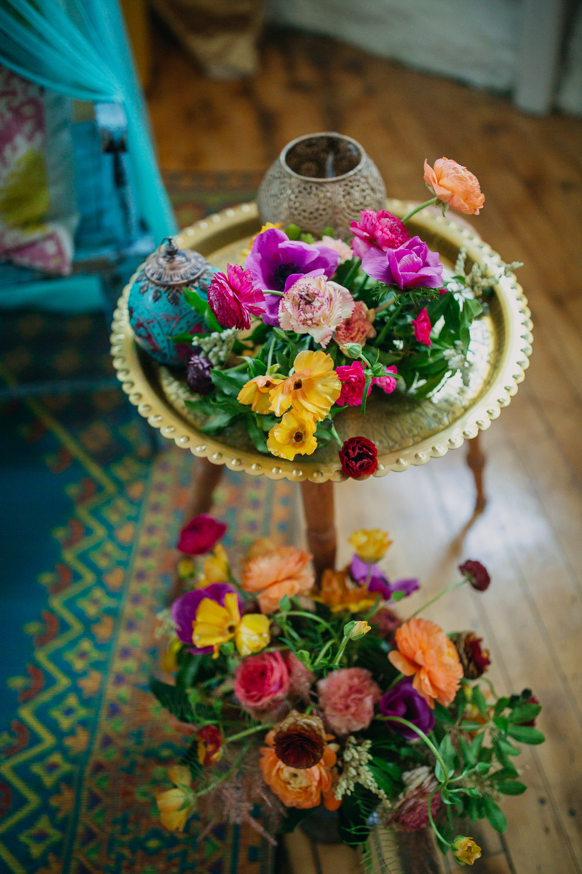 Bright flowers, brass plates and lanterns for decoration.