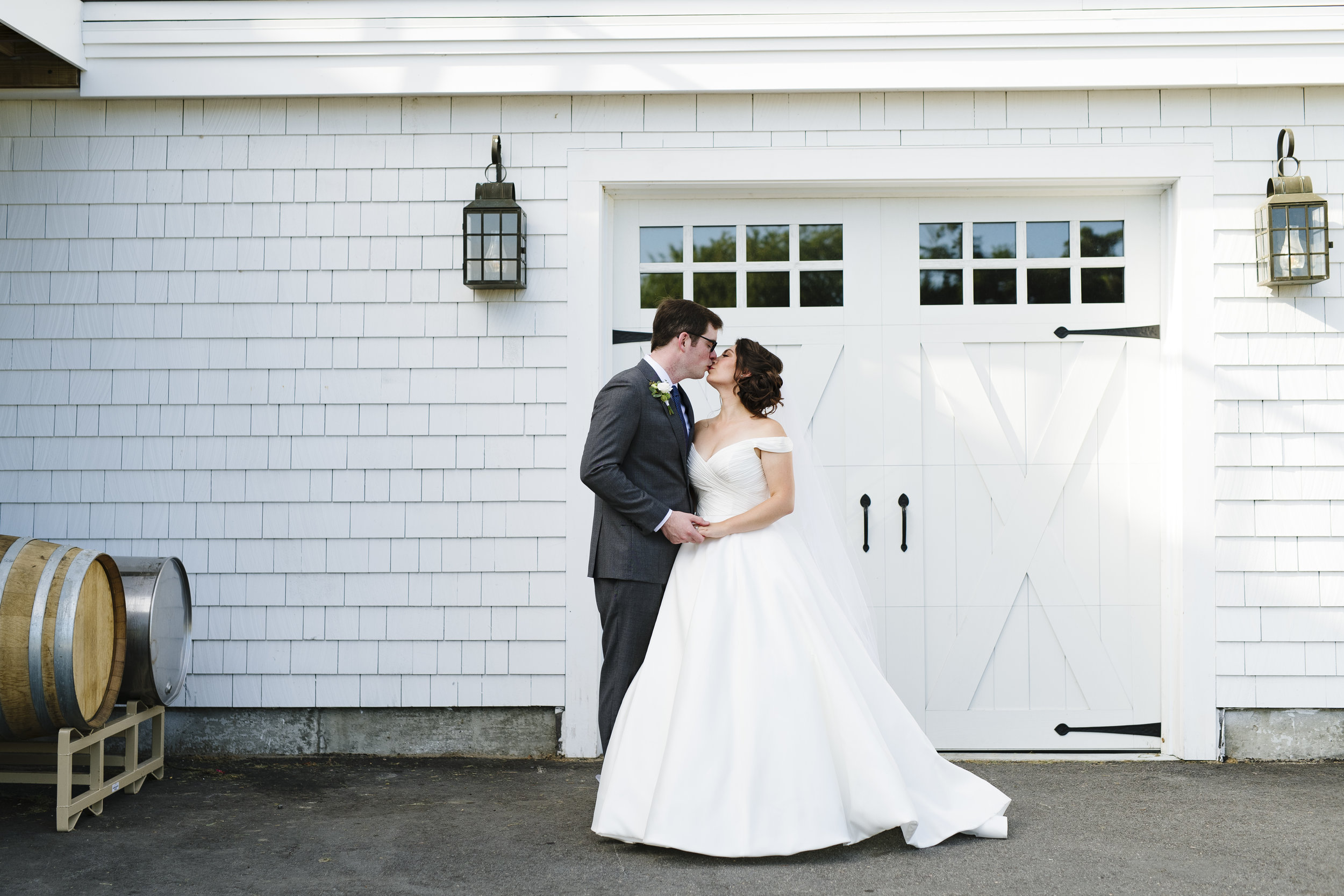 Bride and groom first look in the vineyard at Jonathan Edwards Winery in Connecticut - Pearl Weddings &amp; Events