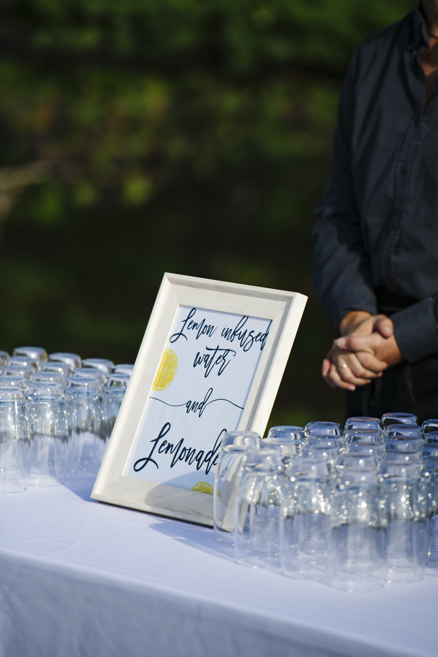 Welcome Station with lemonade for the wedding ceremony at Jonathan Edwards Winery - Pearl Weddings &amp; Events