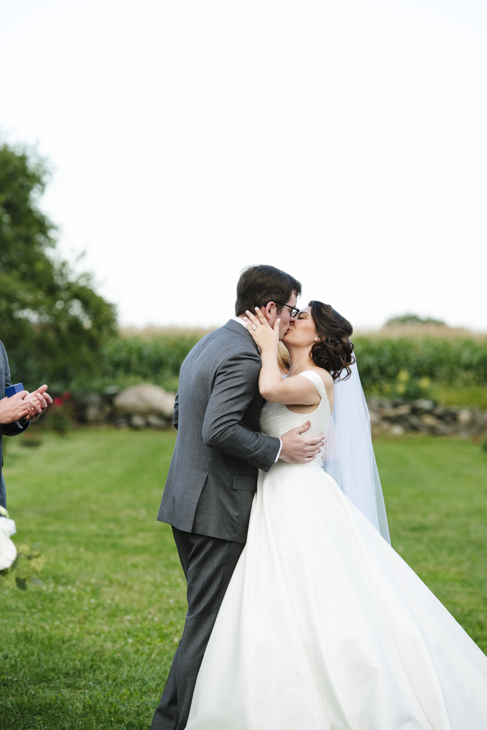 Bride and groom first look in the vineyard at Jonathan Edwards Winery in Connecticut - Pearl Weddings &amp; Events