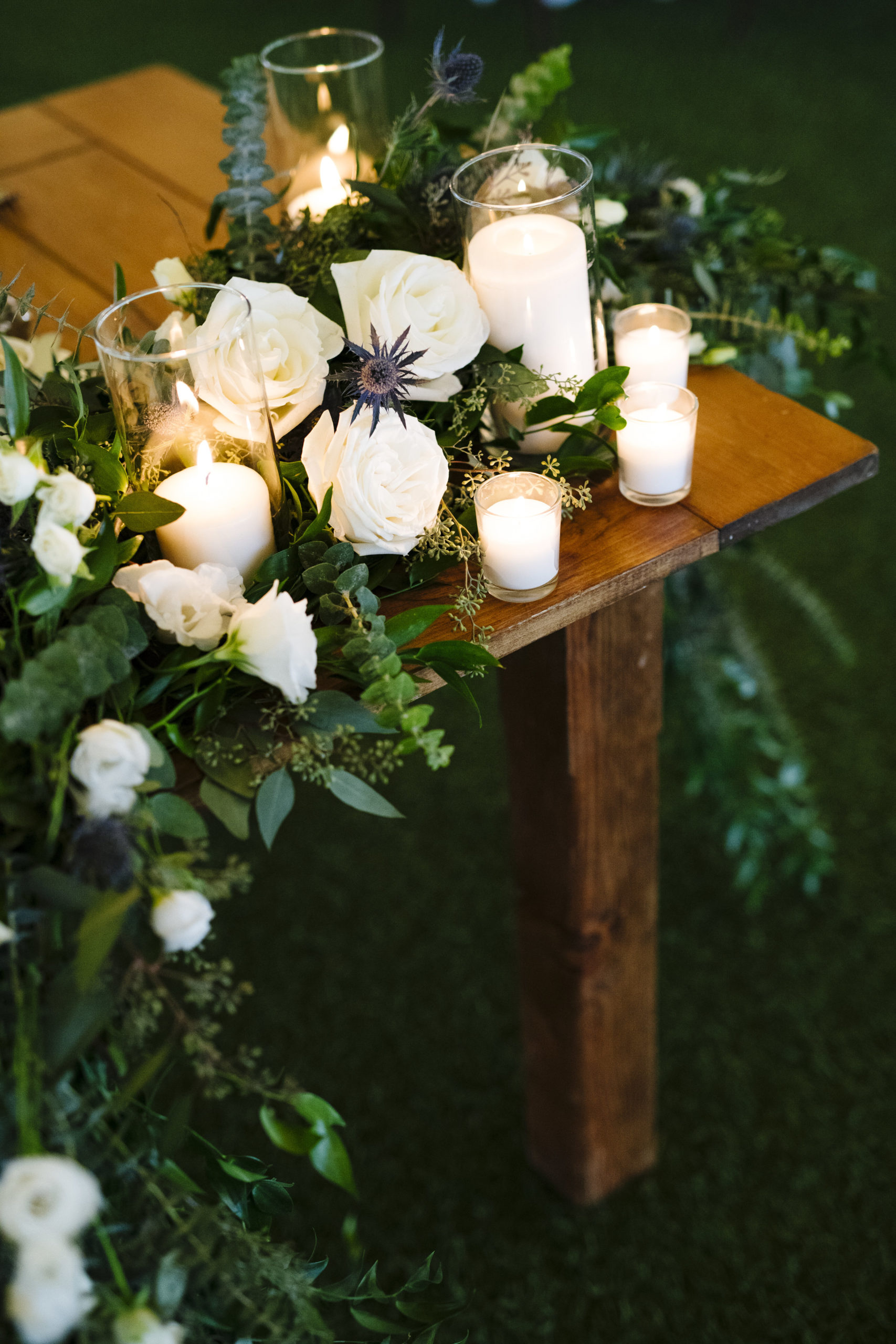 Farm table sweetheart table with white rose and greenery at Jonathan Edwards Winery - Pearl Weddings &amp; Events