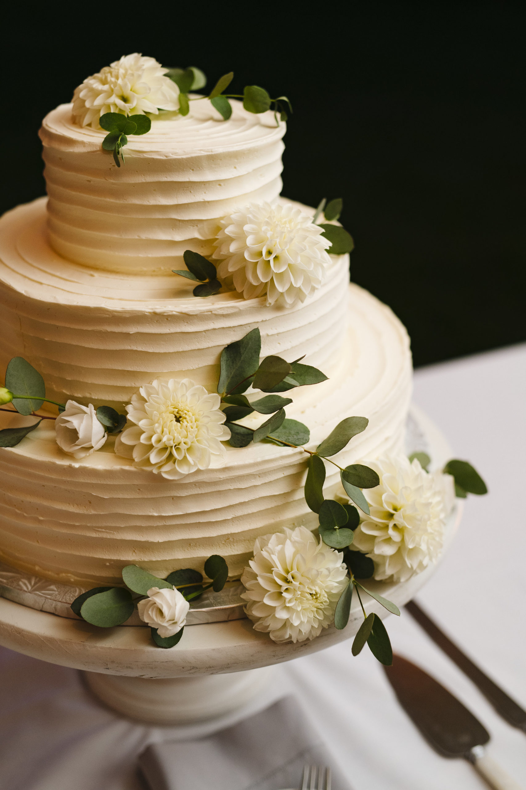 Tiered buttercream cake by A Thyme To Cook with Brambles and Bittersweet flowers at Jonathan Edwards Winery in Connecticut - Pearl Weddings &amp; Events