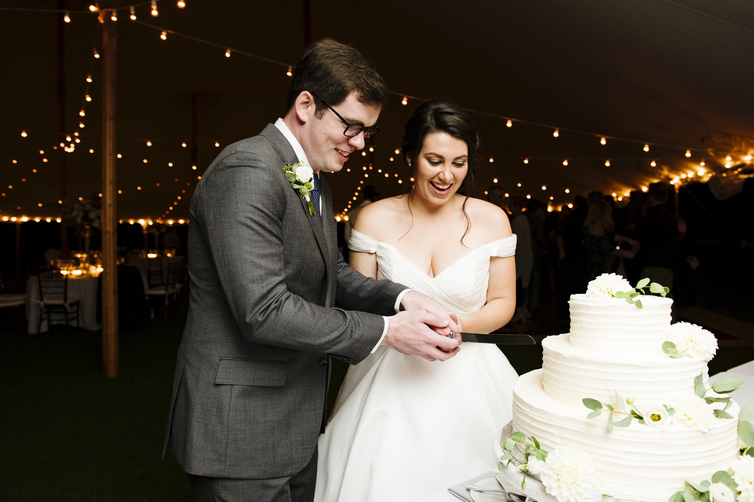 Cake cutting with the bride and groom at Jonathan Edwards Winery - Pearl Weddings &amp; Events