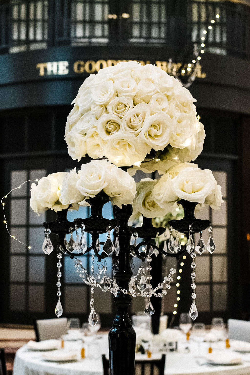 Tall black and white rose floral centerpieces for Melanie &amp; Tyler Anderson's wedding - Pearl Weddings &amp; Events