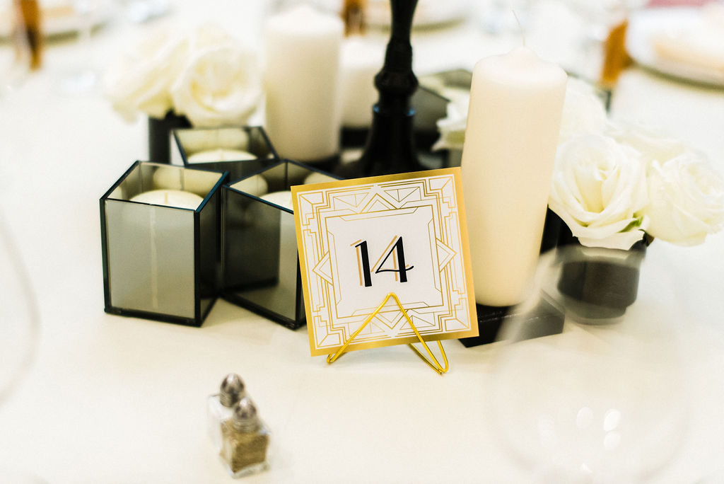 Black, white and gold details for the tables centerpiece at a Great Gatsby themed wedding - Pearl Weddings &amp; Events