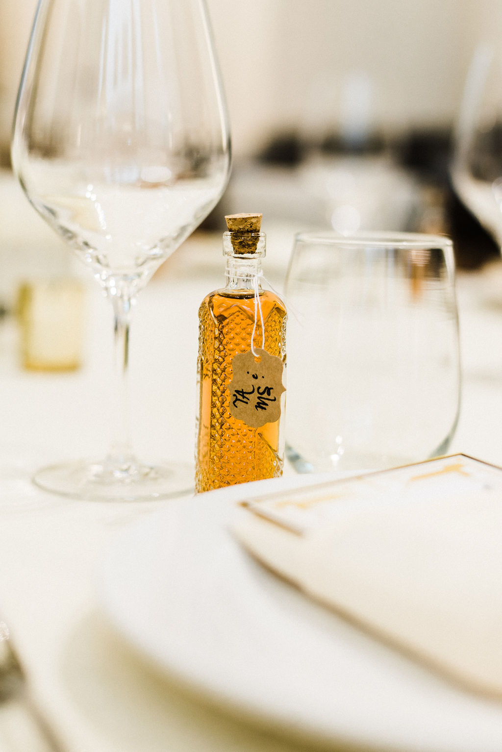 Small bottles of liquor as favors for the guest at Melanie &amp; Tyler's Great Gatsby themed wedding at The Goodwin Hotel - Pearl Weddings &amp; Events