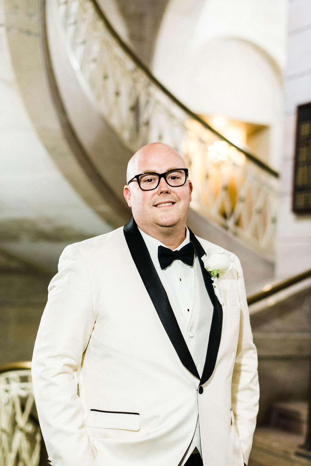 Tyler Anderson looking fabulous on his wedding day wearing a Vera Wang all white suit and bow tie - Pearl Weddings &amp; Events