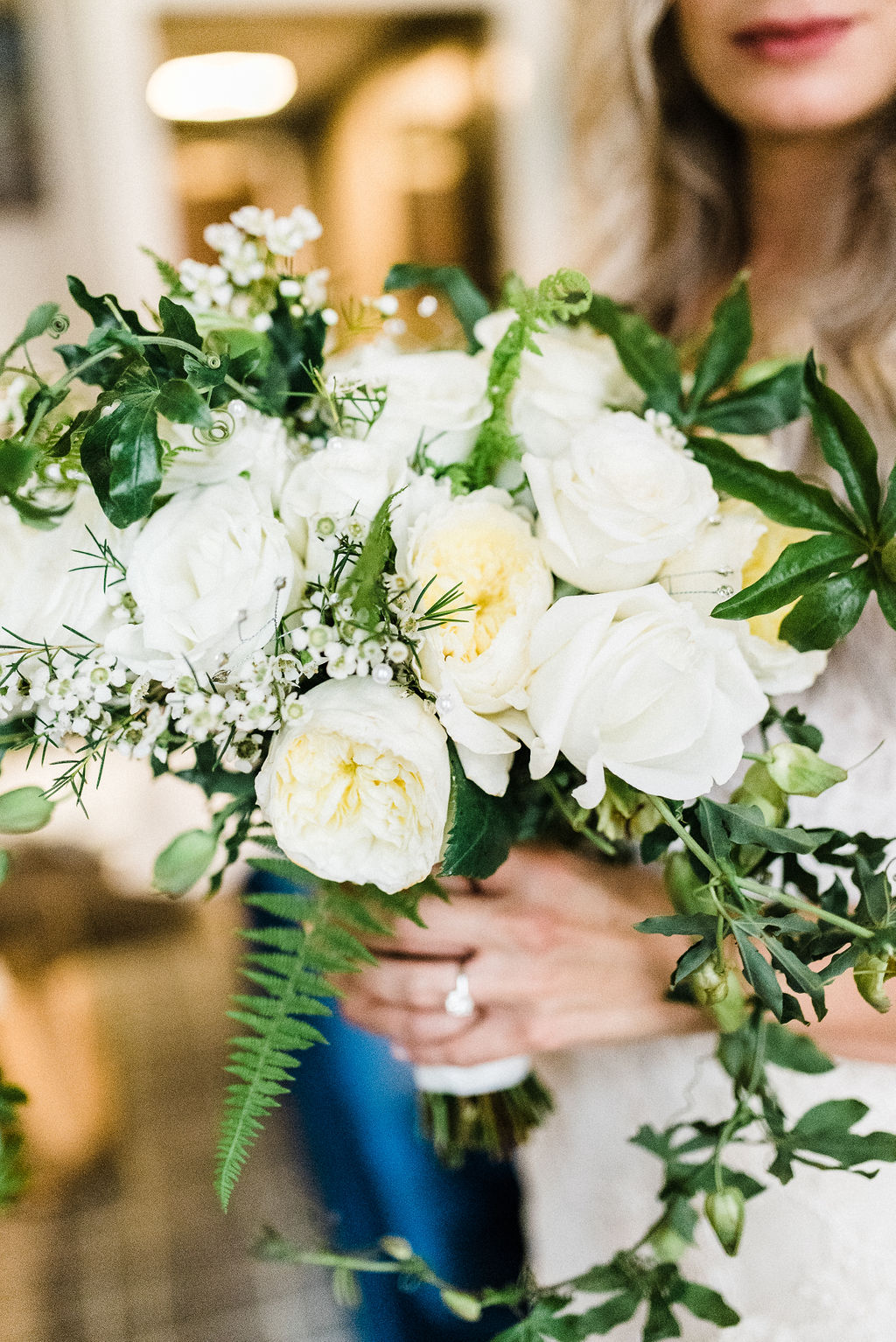 Brides bouquet with white roses, greenery and blue and white passion flowers - Pearl Weddings &amp; Events
