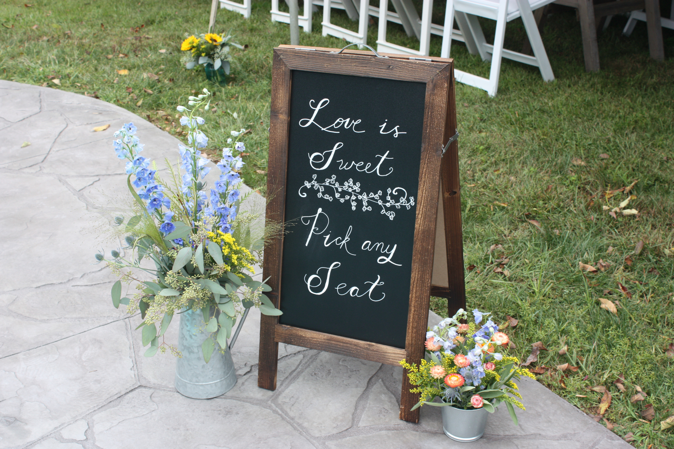 Love is sweet pick any seat sign for a outdoor tented wedding reception - Pearl Weddings &amp; Events
