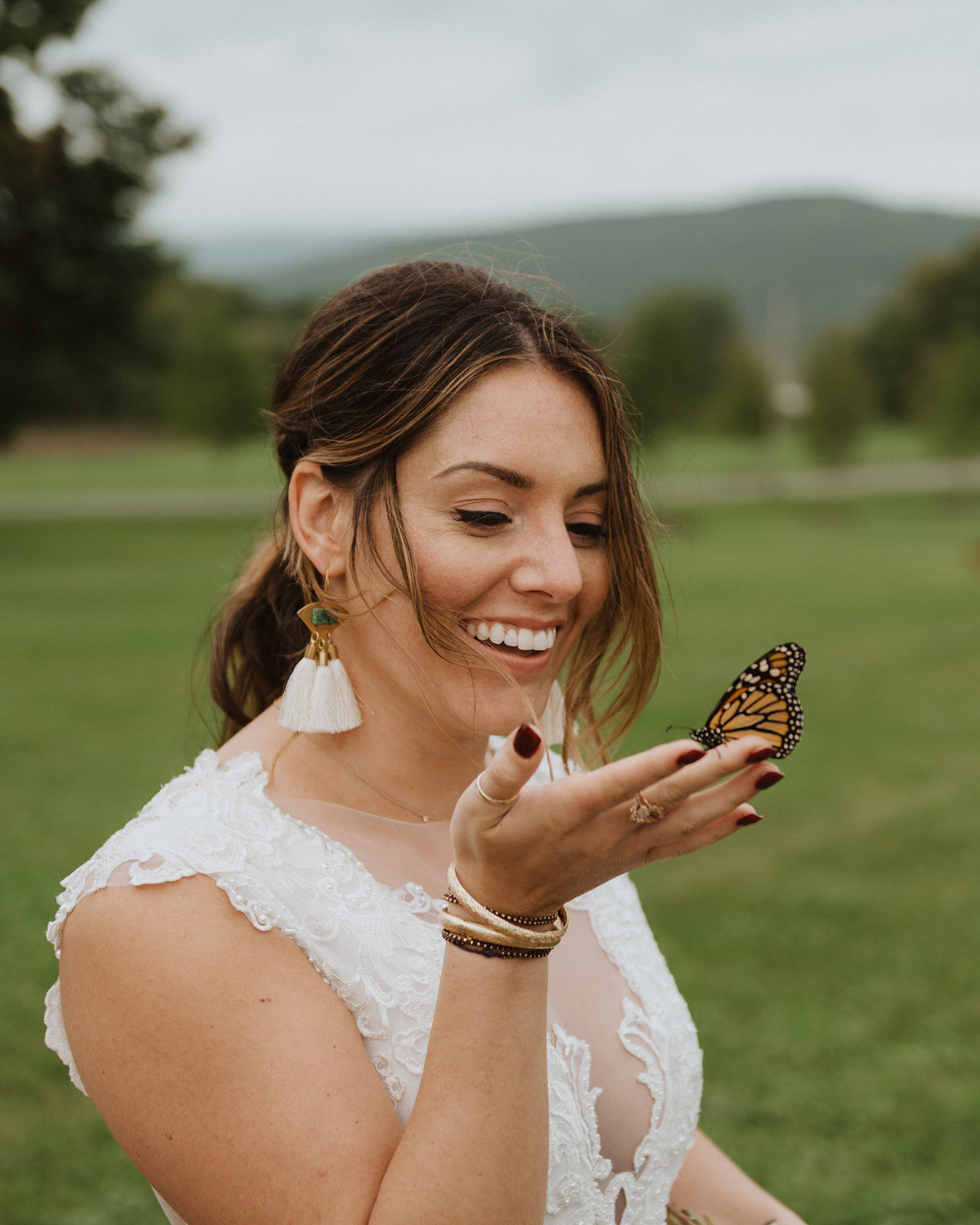 Boho bride with a butterfly at Lion Rock Farm