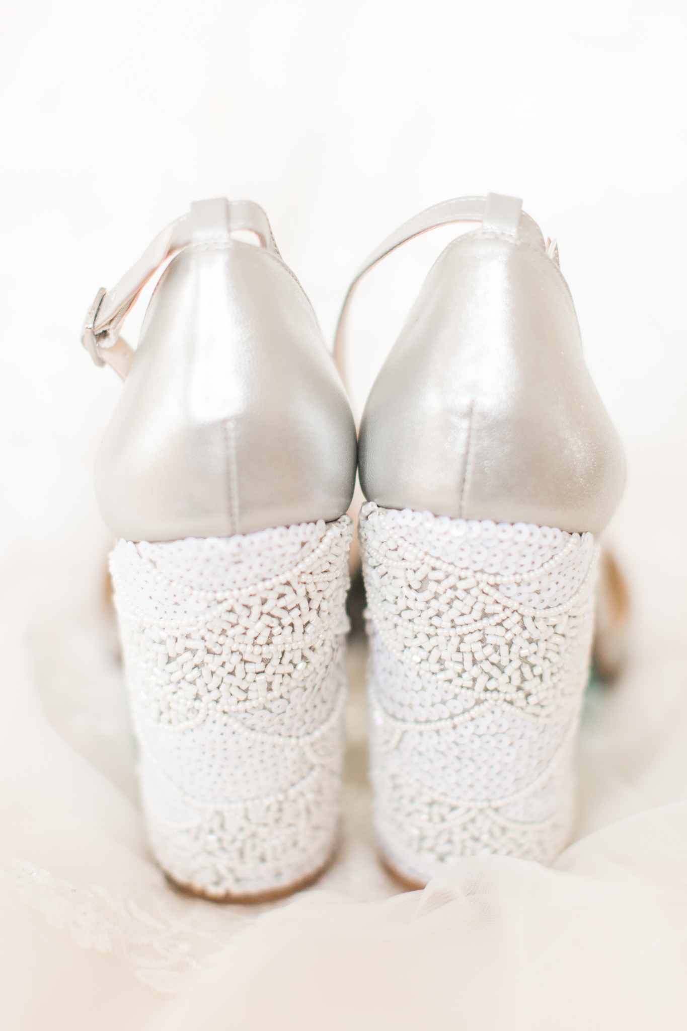 Silver close toes brides shoes with chunky heel peal details in white. - Pearl Weddings &amp; Events
