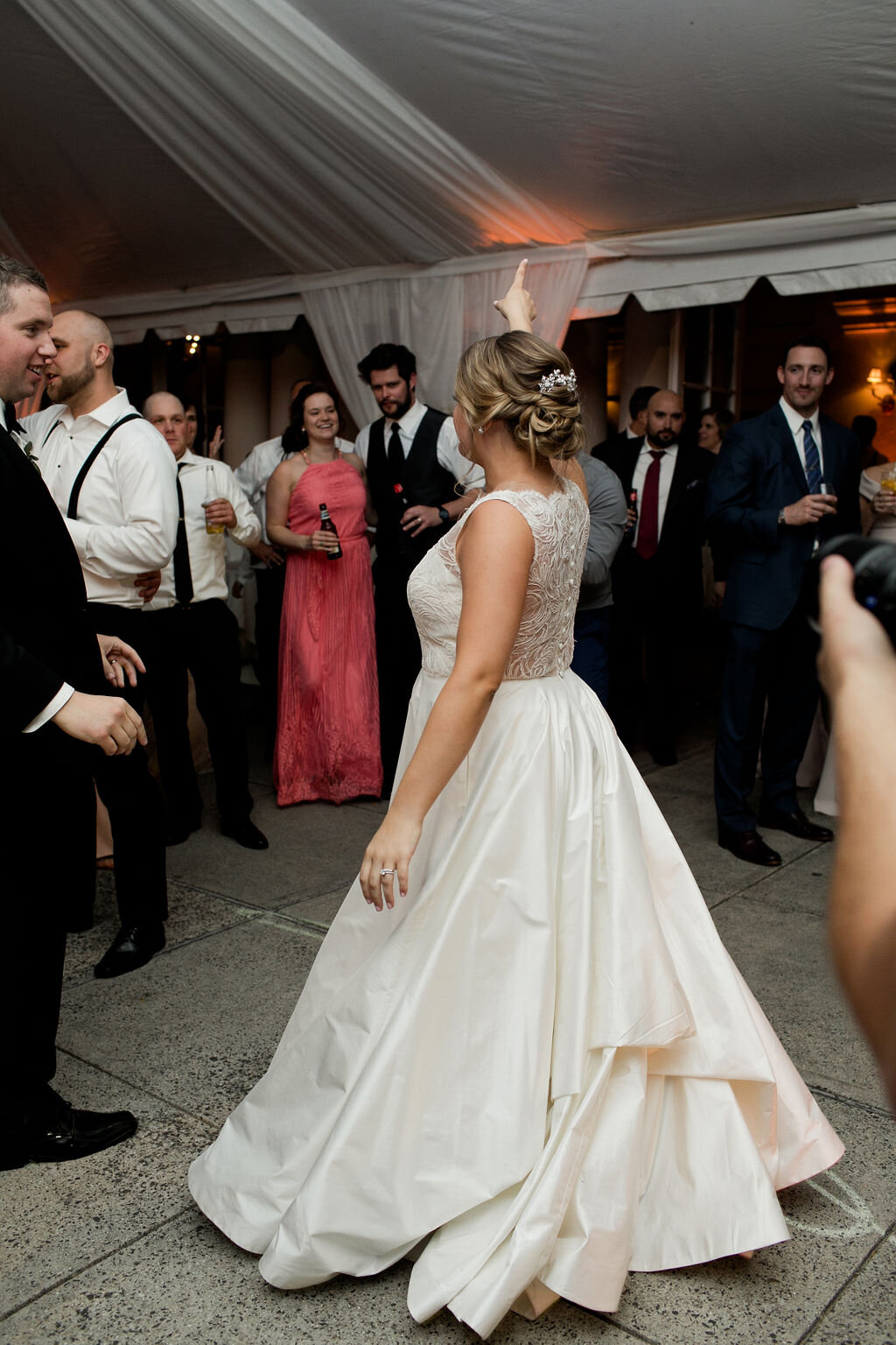 Bride dancing under tent - Pearl Weddings &amp; Events