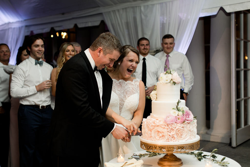 Bride and groom cake cutting - Pearl Weddings and Events