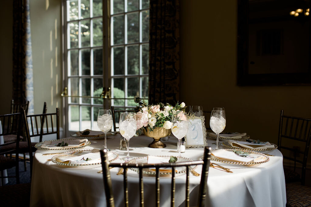 Reception table details with gold chivari chairs - Pearl Weddings &amp; Events