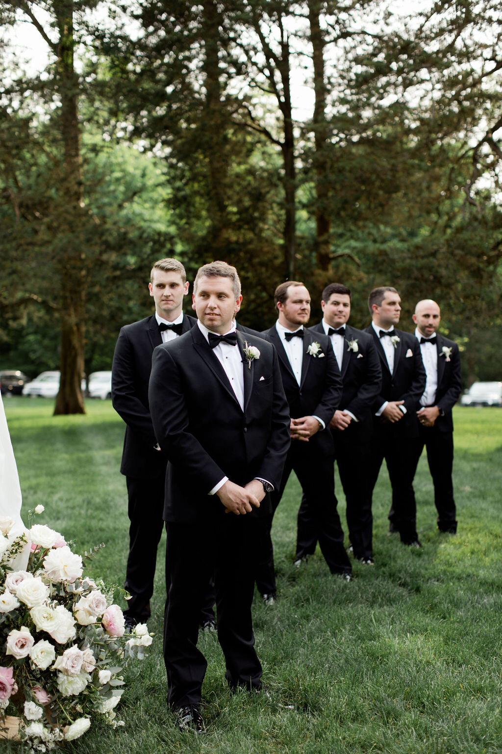 Groomsmen in all black tuxedos and bow ties - Pearl Weddings &amp; Events