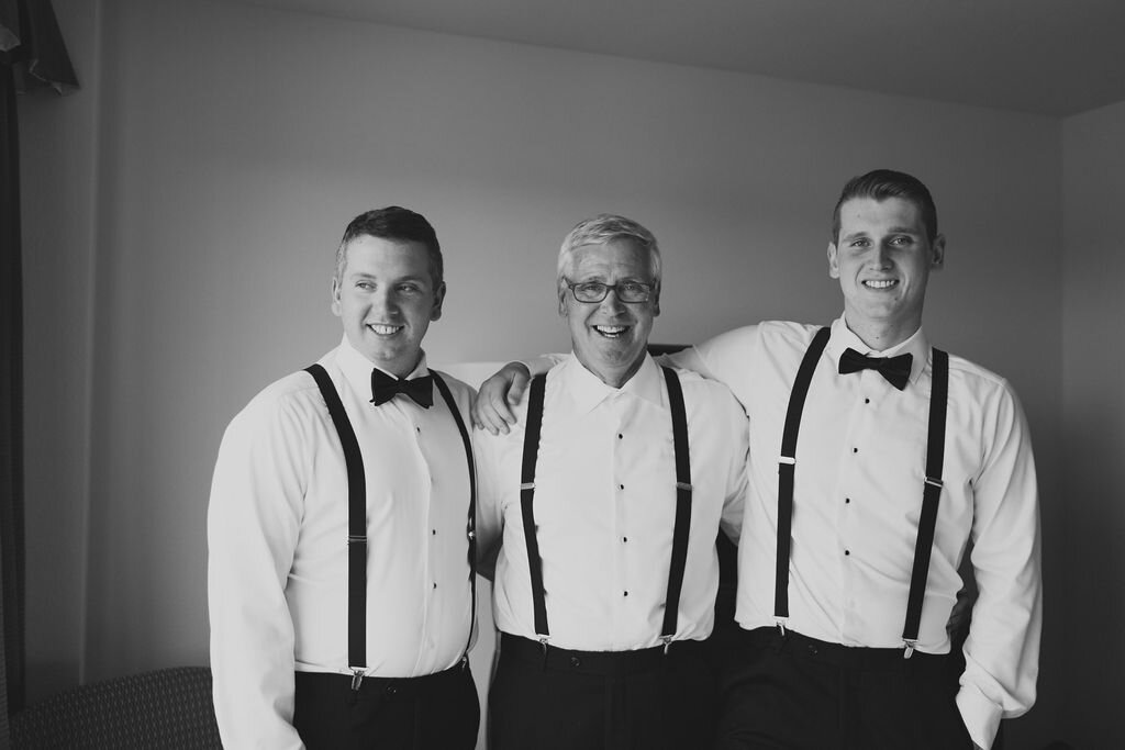 Groom and groomsmen in suspenders in bow tie - Pearl Weddings and Events