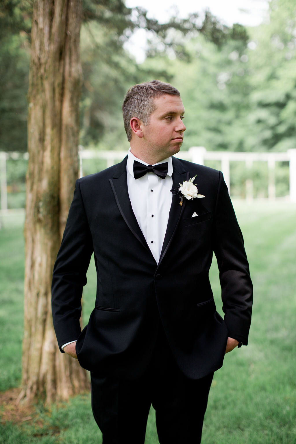 Grooms black suit with bow tie and suspenders - Pearl Weddings &amp; Events