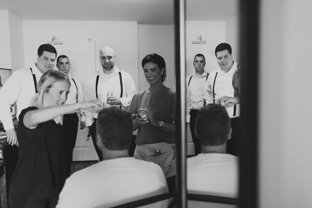 Groomsmen in suspenders getting ready - Pearl Weddings &amp; Events