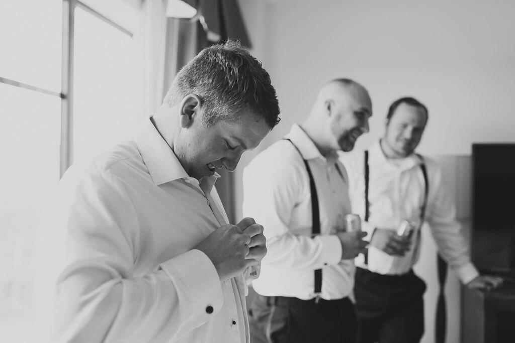 Groom and groomsmen in suspenders getting ready - Pearl Weddings and Events