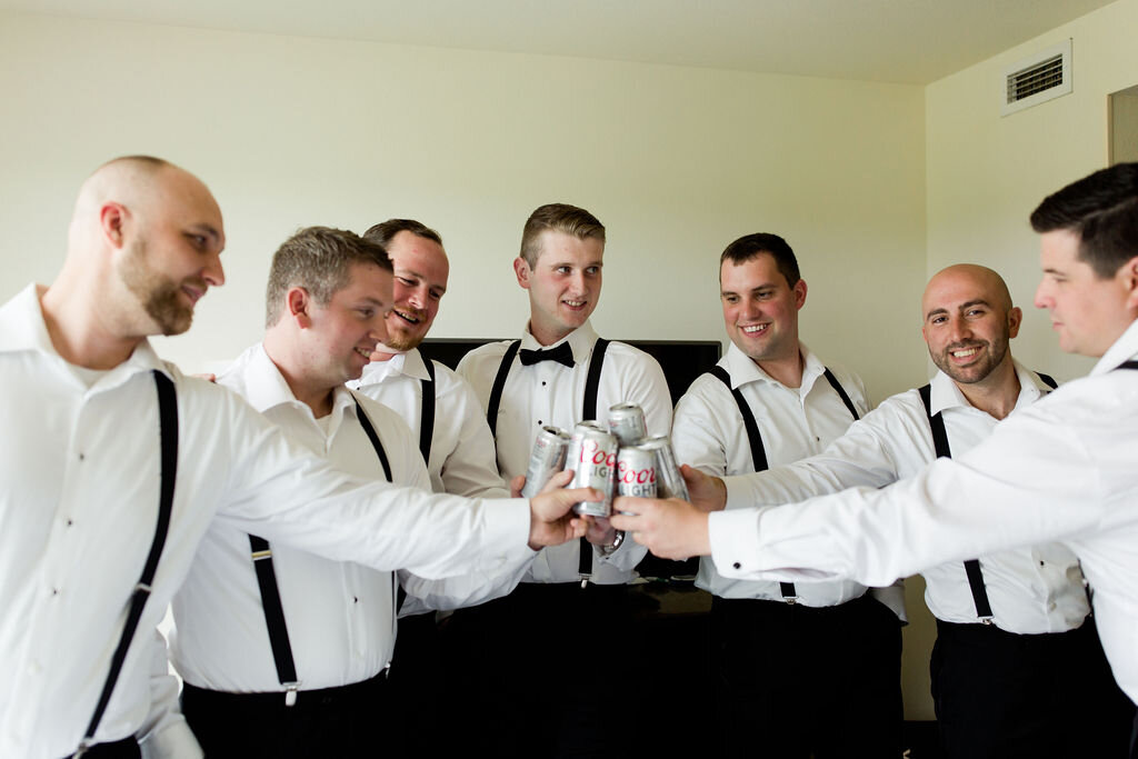 Groomsmen in suspenders with coors light - Pearl Weddings &amp; Events