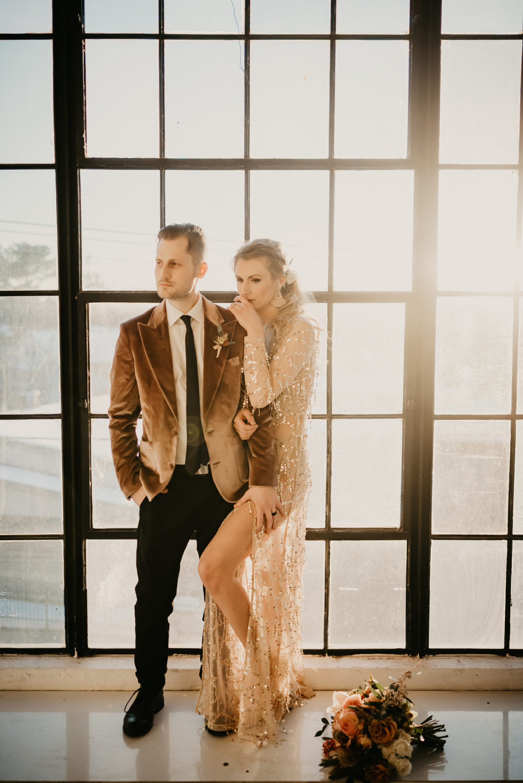Bride in a sequins gown and groom in a velvet jacket for their Mid-Century Modern Boho wedding - Pearl Weddings &amp; Events