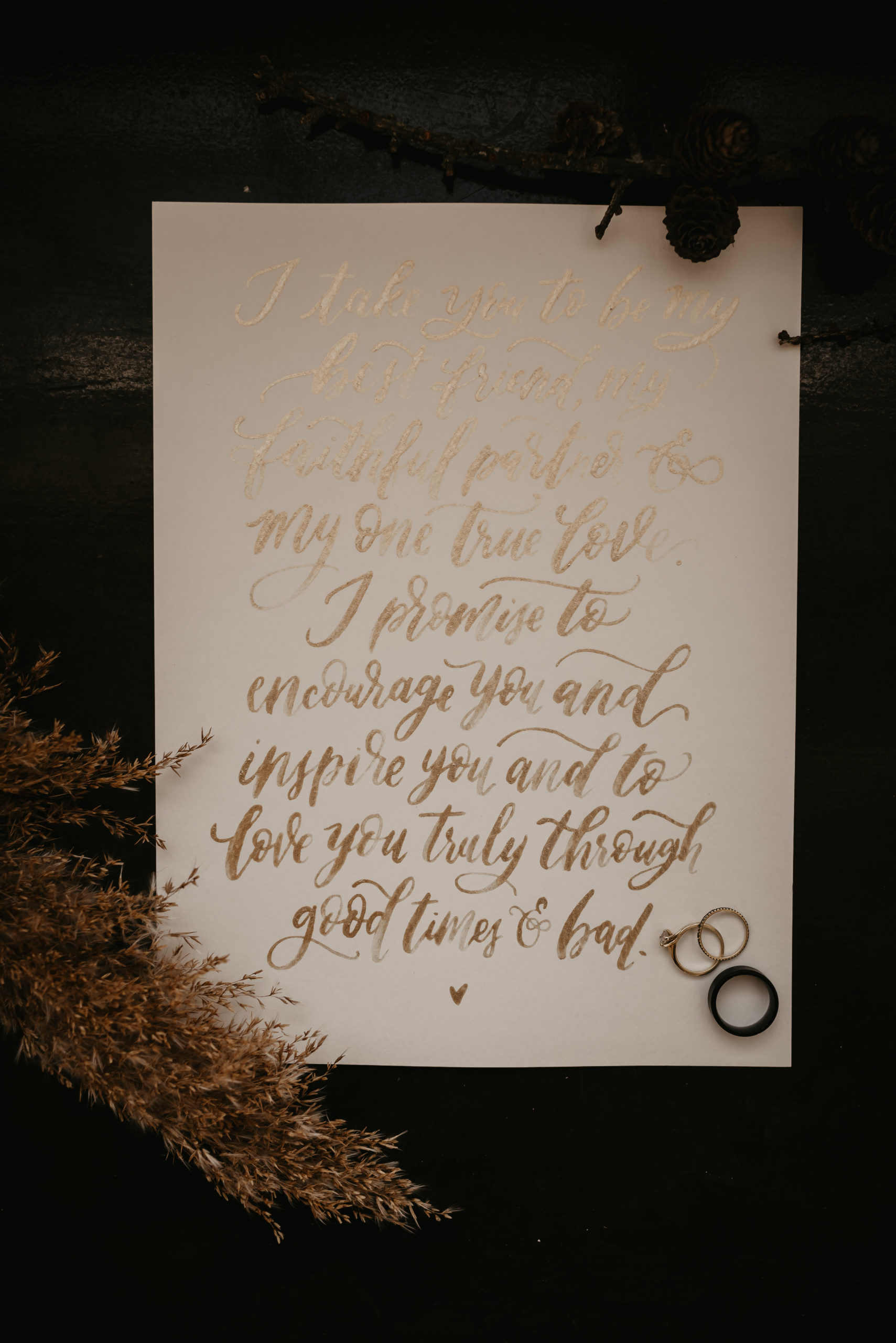 Vows written in gold leaf on white paper with a black wedding stationery set - Pearl Weddings &amp; Events
