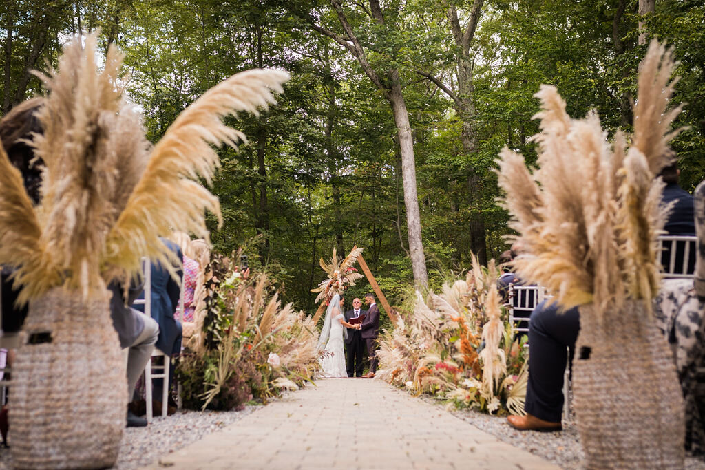 Boho wedding ceremony with triangle arch - Pearl Weddings &amp; Events