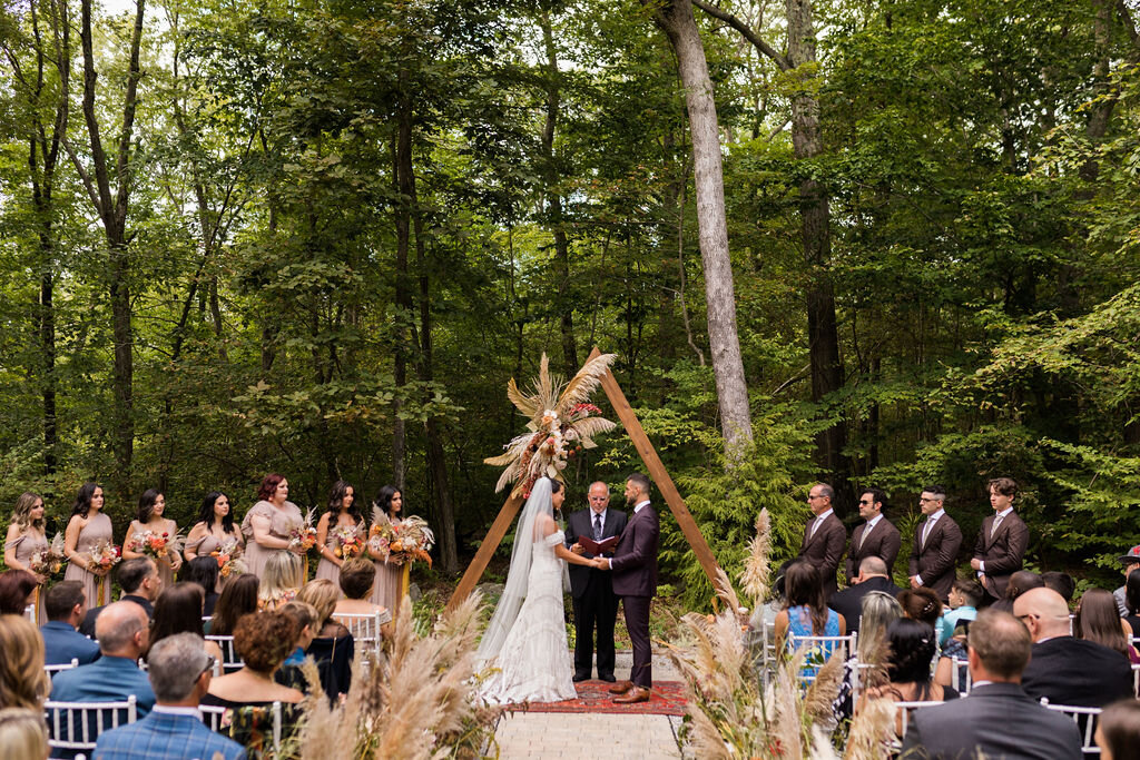 Boho wedding ceremony with triangle arch - Pearl Weddings &amp; Events