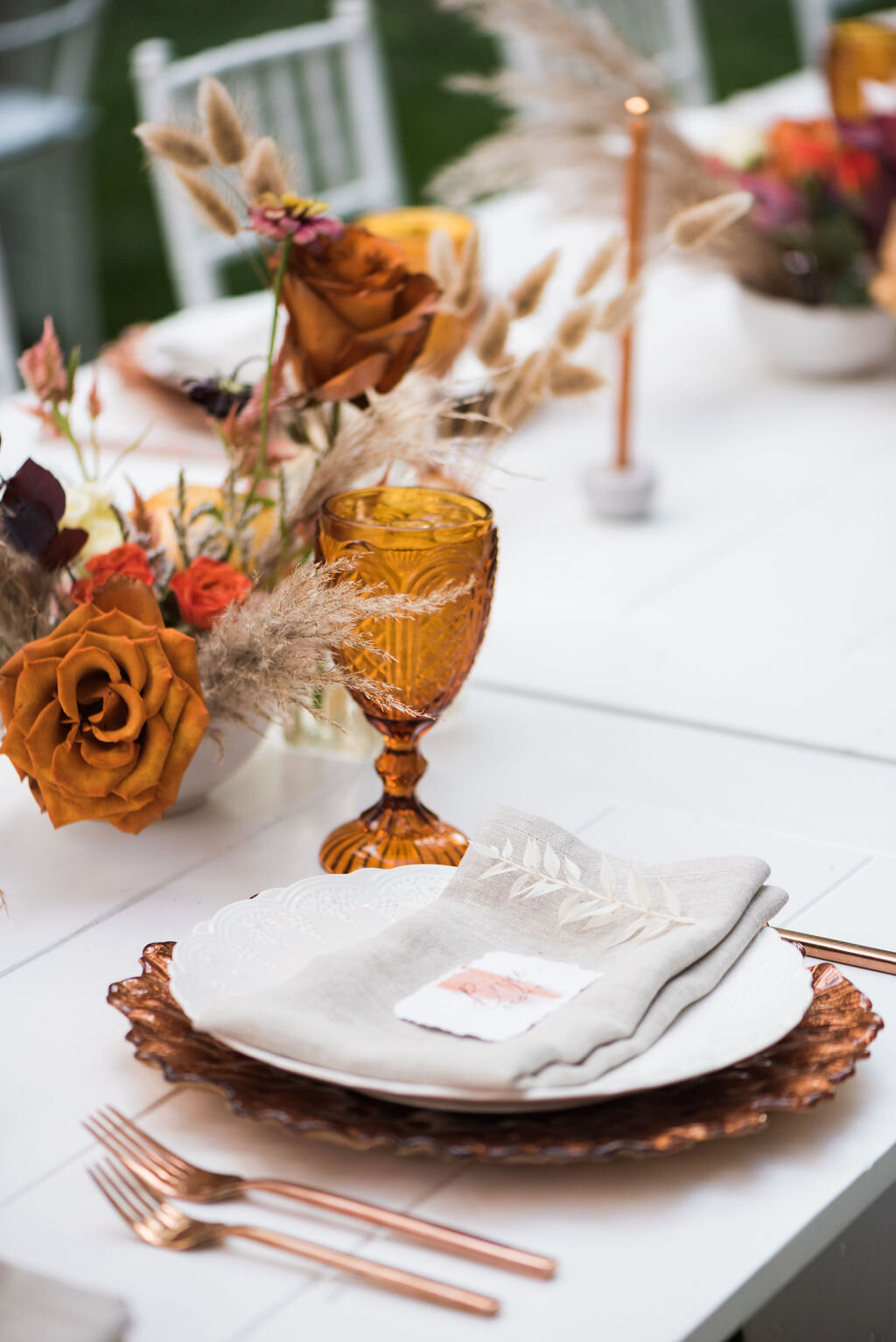 Bright fall tones with white farm tables for your wedding tablescape - Pearl Weddings &amp; Events