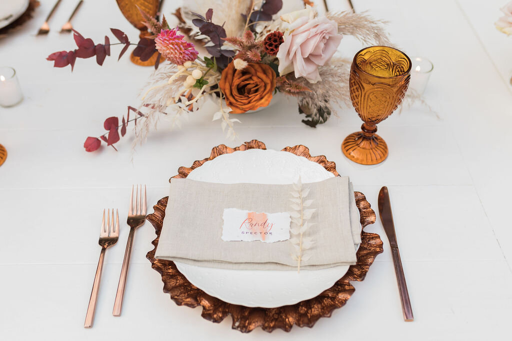 Amber and Copper wedding table settings with beige napkin - Pearl Weddings &amp; Events