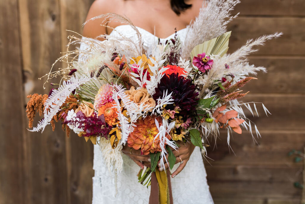 Large boho bouquet with dried flowers and bold colors - Pearl Weddings &amp; Events