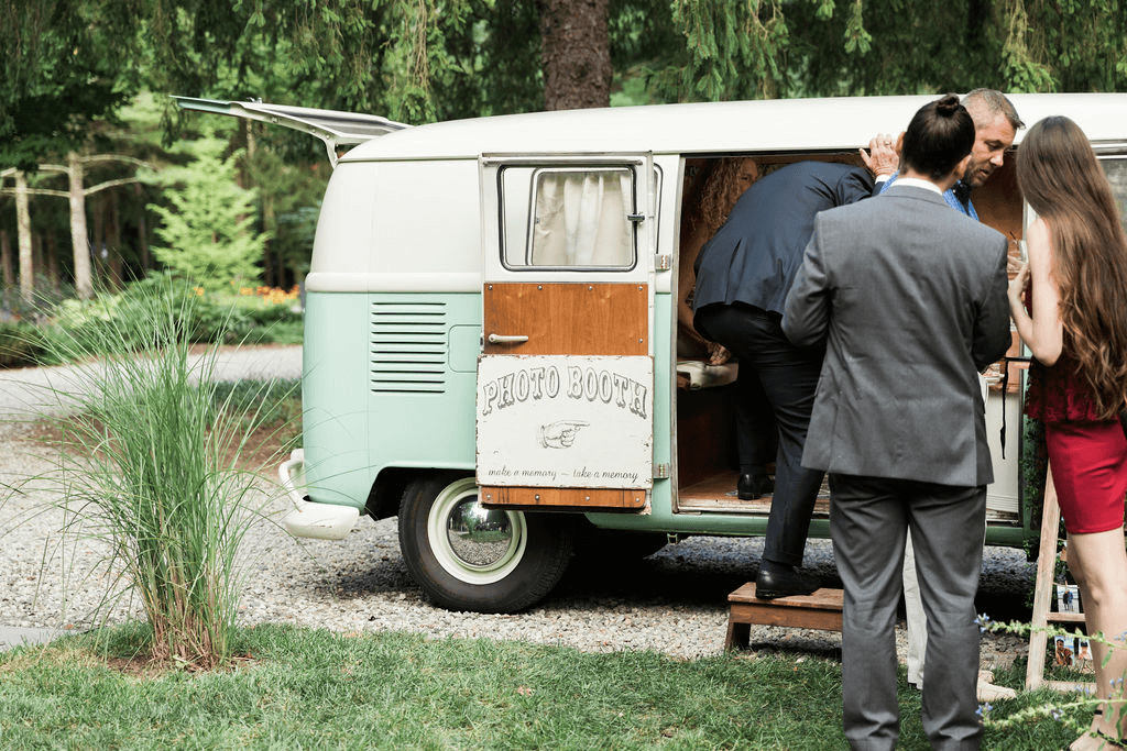 A vintage van with a sign that read "photobooth"