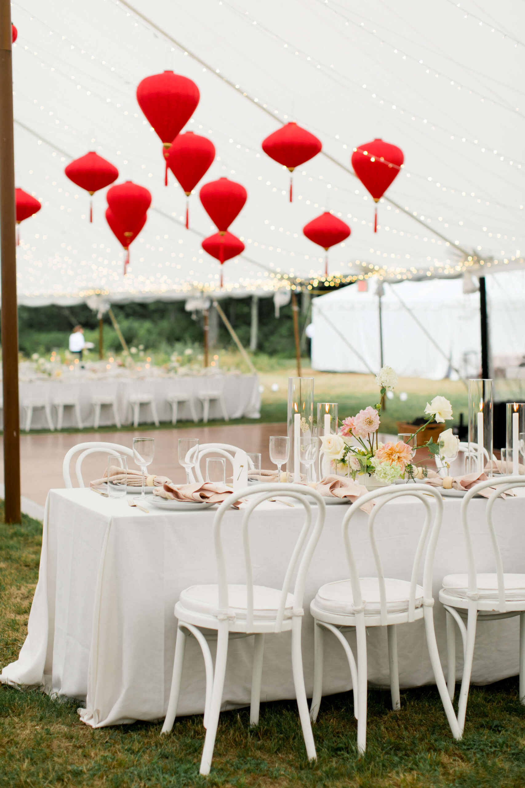Red Chinese lanterns were hung in the tent of a Connecticut Wedding.