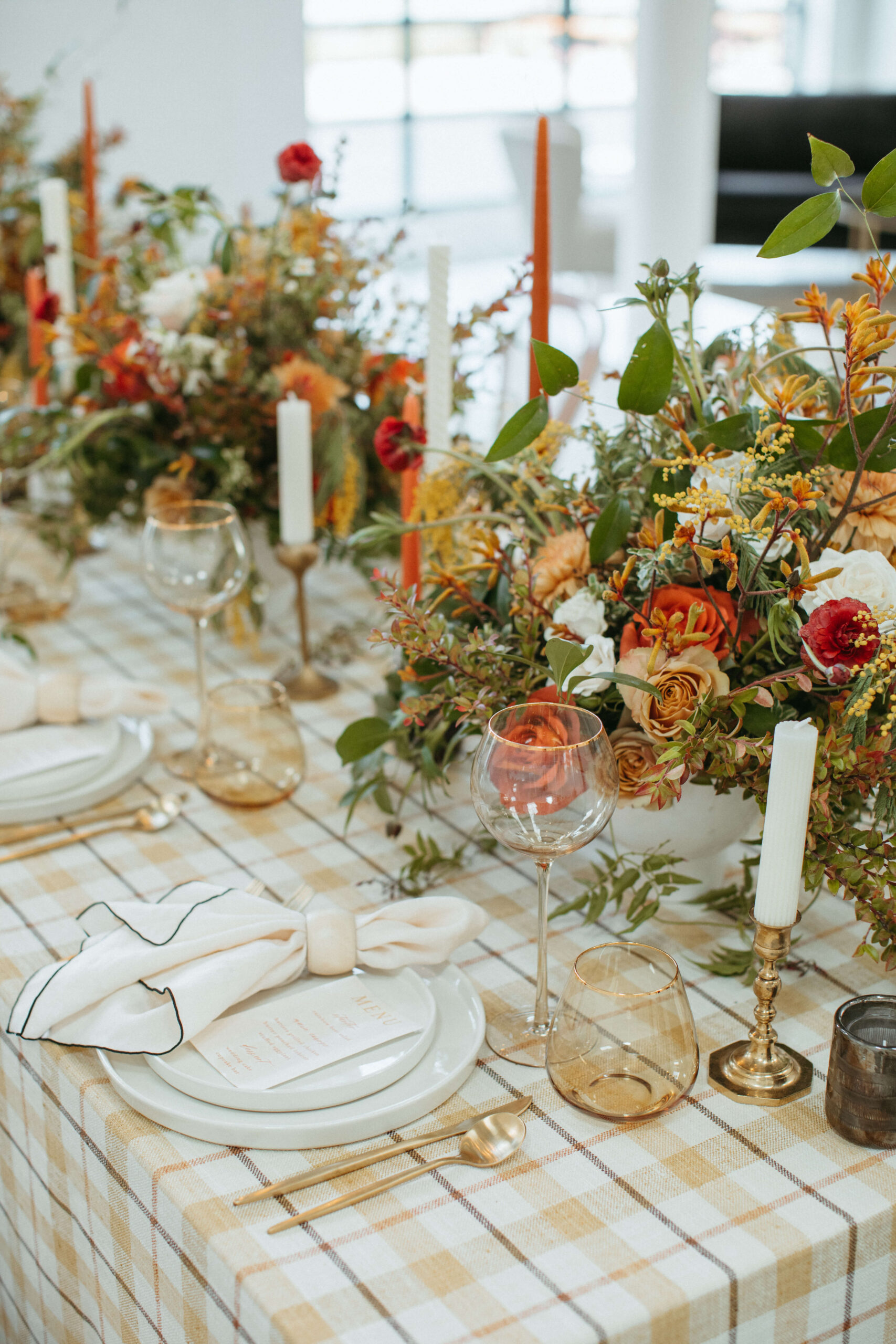 A rustic modern table setting with gold details and Sound River Studios