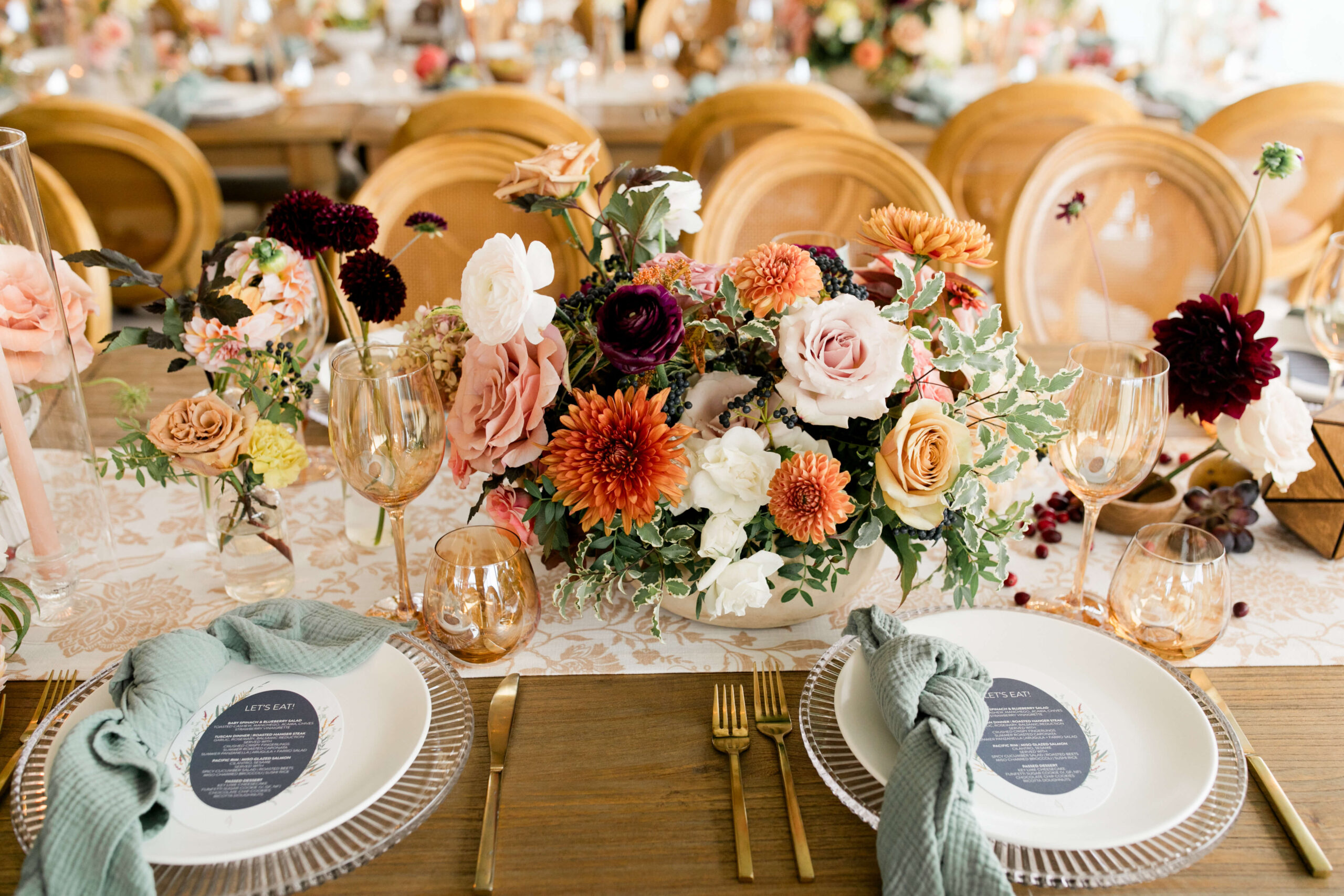 Reception table decorated with fresh fruit and vibrant florals